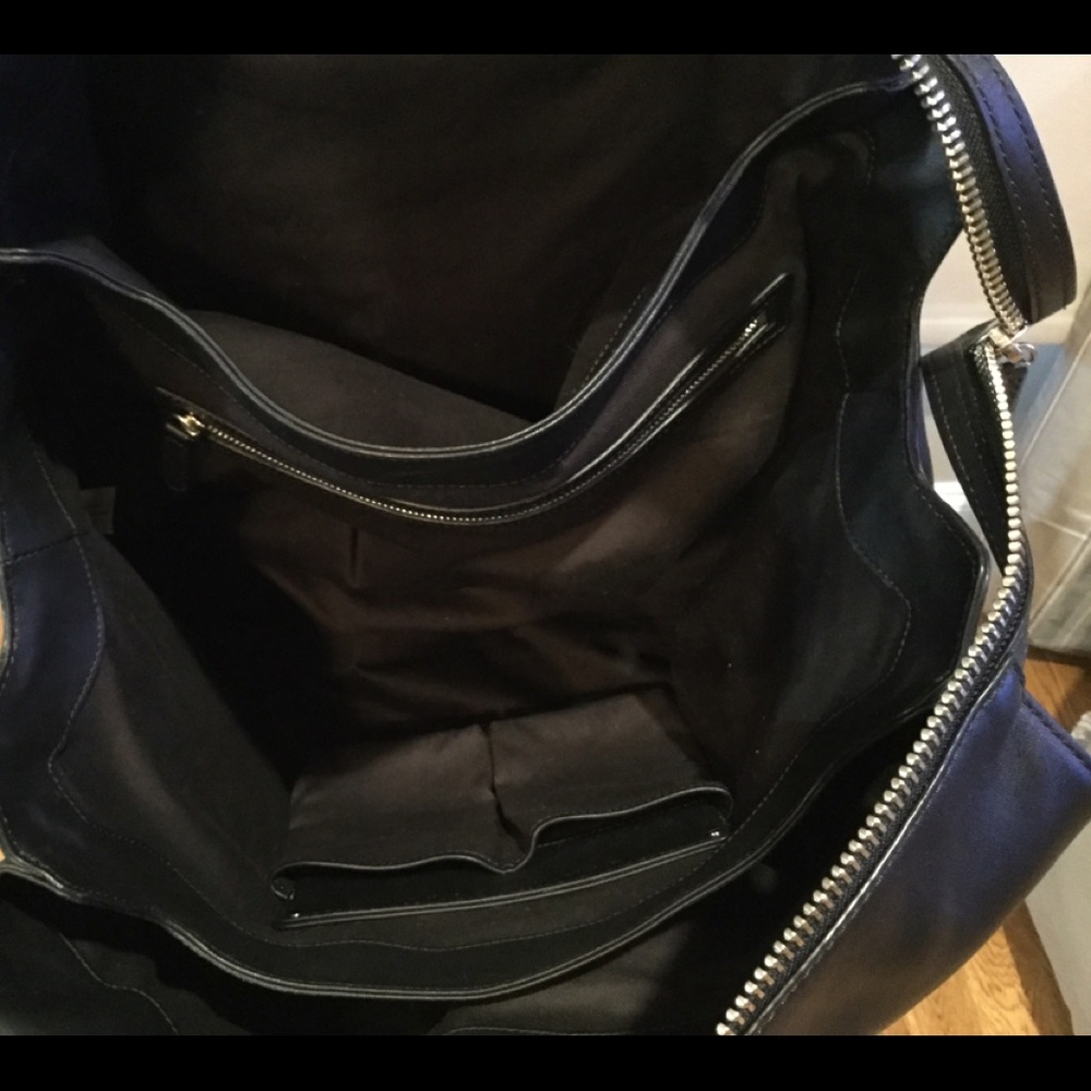 Aritzia’s Six Eleven black leather McDuffle - Picture 10 of 14